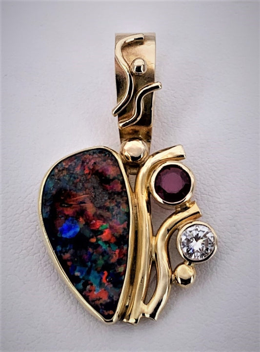 Australian Boulder Opal, Ruby, and Diamond Pendant is 18k and 14k Gold